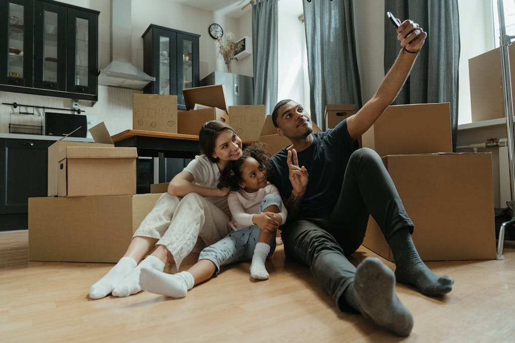 Florida Hometown Heroes can help a happy family take a selfie amidst moving boxes in their new home.