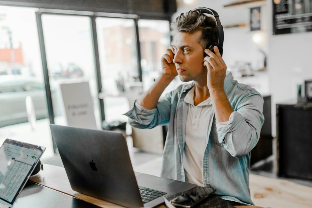 Why every agent should start a virtual call center. Men's blue collared top near silver MacBook