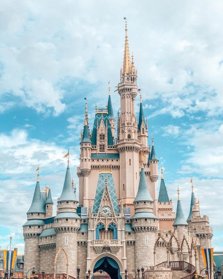 Cinderella Castle with blue turrets and stone walls in Magic Kingdom, Orlando
